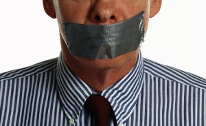 Businessman with Taped Mouth --- Image by © Larry George/Corbis